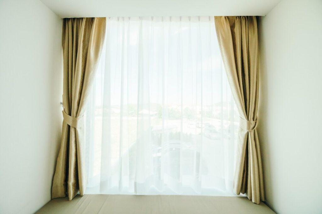 window with double curtain rod decoration